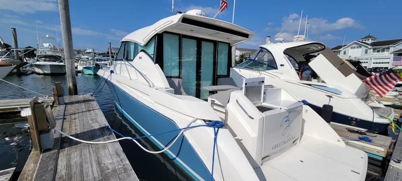 Slide: The Image of 2018 Tiara Yachts 39 docked at marina, featuring sleek design and modern amenities. - 6