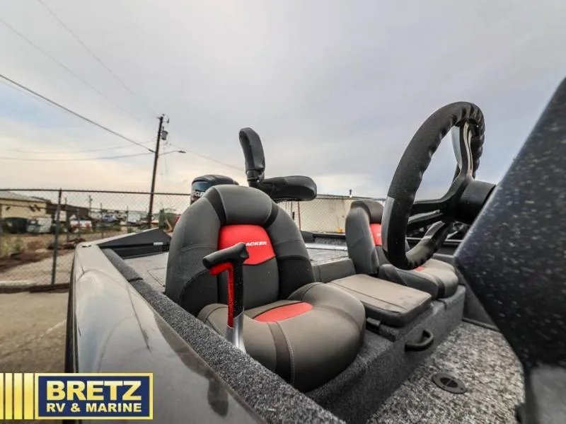 Slide: The Image of 2025 Pro Team 175 TXW boat interior with steering wheel and seats, Bretz RV & Marine. - 12