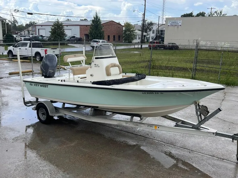 The Image of 2016 Key West 210 Bay Reef boat on trailer, parked outdoors. - 1