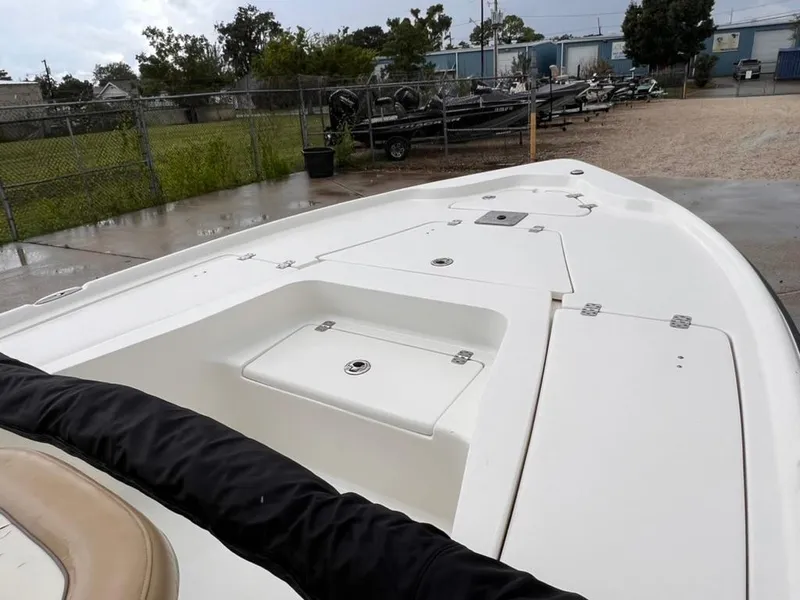 Slide: The Image of 2016 Key West 210 Bay Reef boat, white deck, parked outdoors. - 10