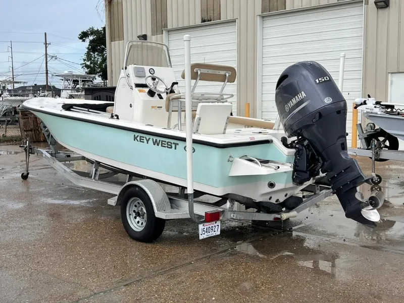 Slide: The Image of 2016 Key West 210 Bay Reef boat with Yamaha 150 engine on trailer. - 4