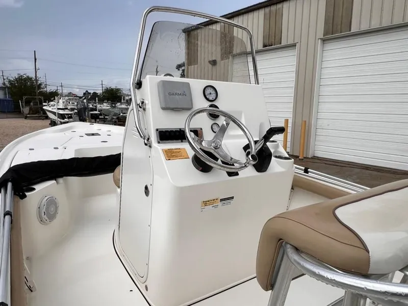 Slide: The Image of 2016 Key West 210 Bay Reef boat console with steering wheel and Garmin device. - 7