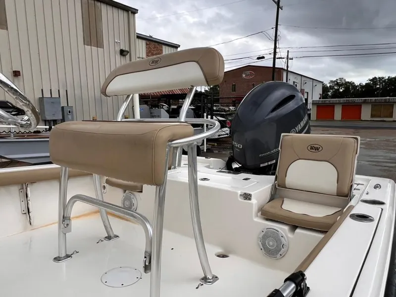 Slide: The Image of 2016 Key West 210 Bay Reef boat with seating and outboard motor. - 8