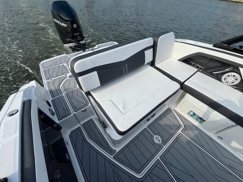 Slide: The Image of 2025 Monterey 255 Super Sport boat with sleek seating and Mercury engine on water. - 11