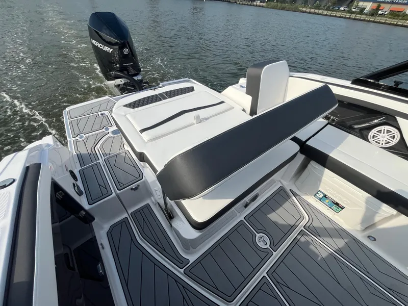 Slide: The Image of 2025 Monterey 255 Super Sport boat with sleek seating and modern design on the water. - 12