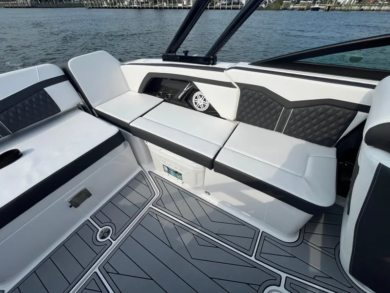 Slide: The Image of 2025 Monterey 255 Super Sport boat interior with sleek seating and modern design. - 17