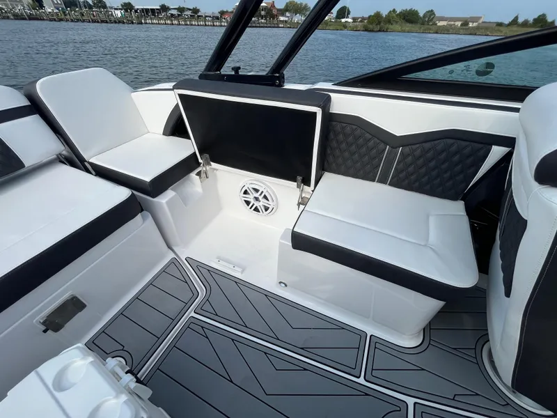 Slide: The Image of 2025 Monterey 255 Super Sport boat interior with sleek seating and modern design. - 19