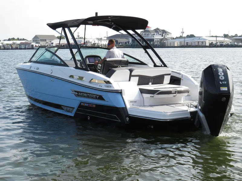 Slide: The Image of 2025 Monterey 255 Super Sport boat on water, featuring sleek design and powerful engine. - 2