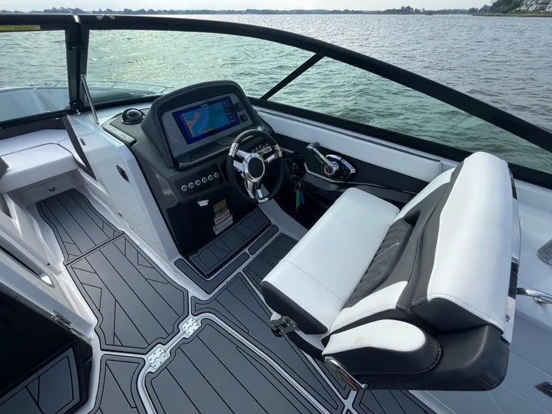 Slide: The Image of 2025 Monterey 255 Super Sport boat interior with sleek dashboard and comfortable seating. - 25