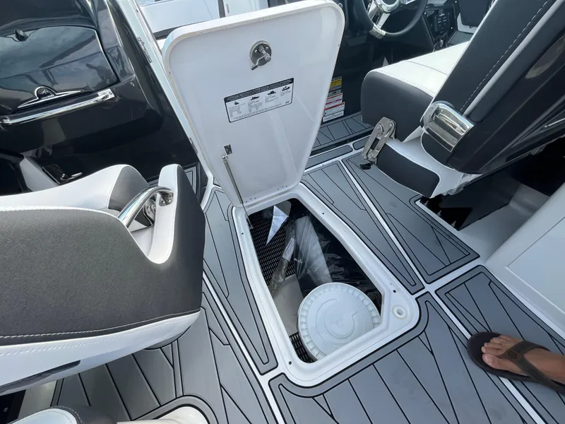 Slide: The Image of 2025 Monterey 255 Super Sport boat interior with open storage compartment. - 31