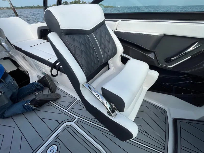 Slide: The Image of 2025 Monterey 255 Super Sport boat interior with luxury seating and modern design. - 32