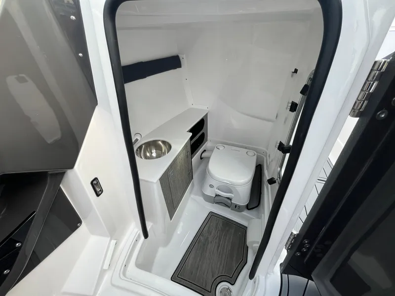 Slide: The Image of 2025 Monterey 255 Super Sport boat interior bathroom with sink and toilet. - 35