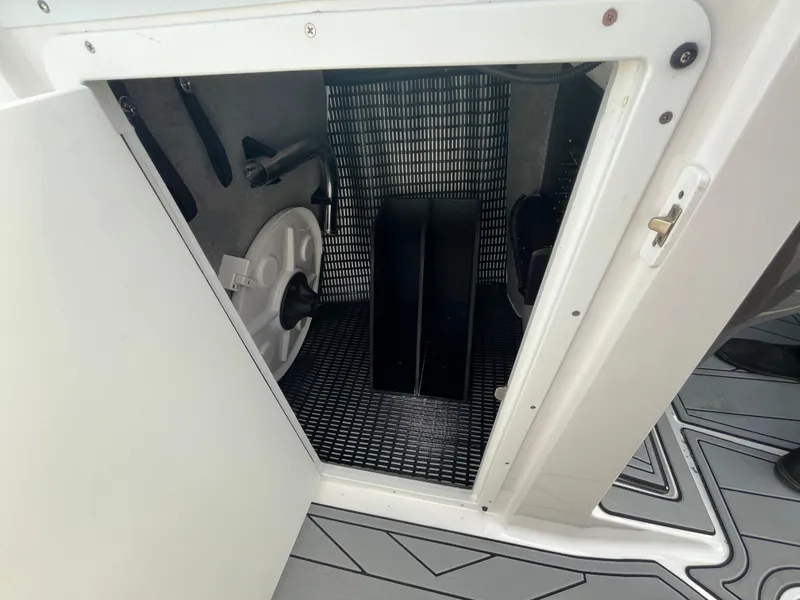 Slide: The Image of Open storage compartment in 2025 Monterey 255 Super Sport boat. - 38