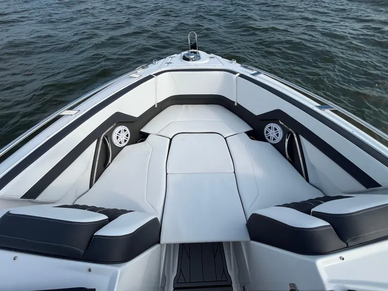 Slide: The Image of 2025 Monterey 255 Super Sport boat interior with sleek seating and modern design on water. - 42