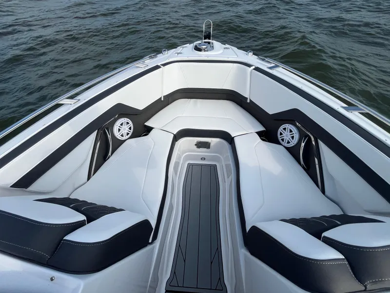 Slide: The Image of 2025 Monterey 255 Super Sport boat interior with sleek seating and modern design on water. - 43