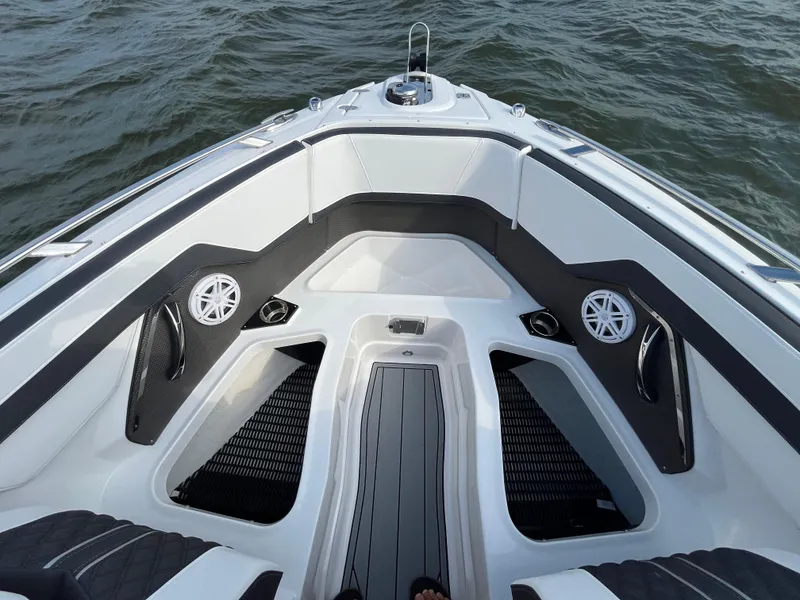 Slide: The Image of 2025 Monterey 255 Super Sport boat interior with sleek seating and speakers on the water. - 44