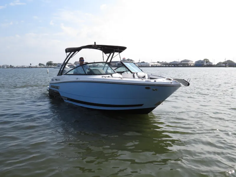 Slide: The Image of 2025 Monterey 255 Super Sport boat cruising on calm water. - 6