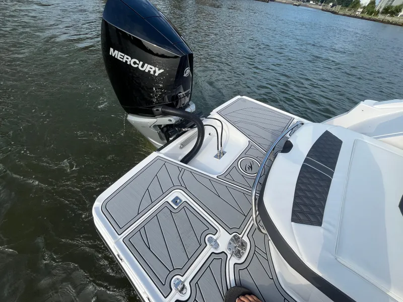 Slide: The Image of 2025 Monterey 255 Super Sport boat with Mercury outboard engine on water. - 7