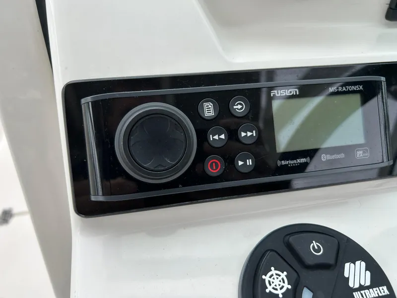 Slide: The Image of Fusion audio system on 2024 Sailfish 226 DC boat dashboard. - 16