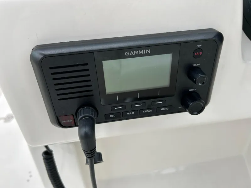Slide: The Image of Garmin marine radio on 2024 Sailfish 226 DC boat dashboard. - 17