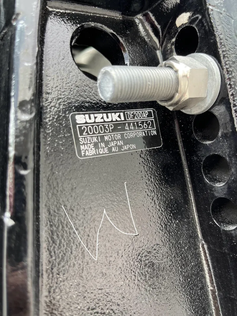 Slide: The Image of Close-up of Suzuki motor part on 2024 Sailfish 226 DC boat. - 27