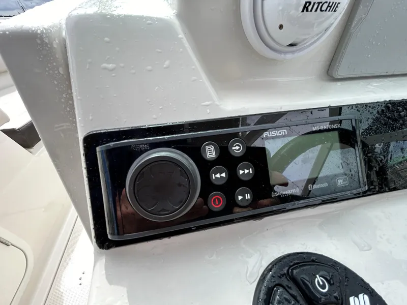 Slide: The Image of Control panel of 2024 Sailfish 226 DC boat with Fusion audio system. - 27