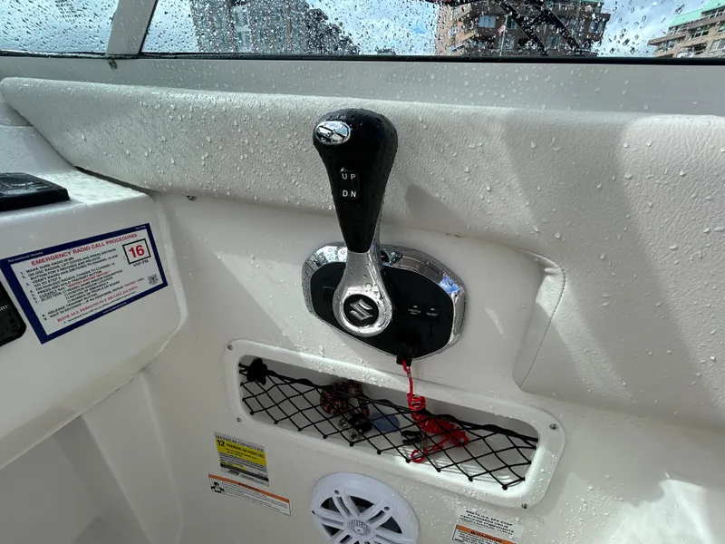 Slide: The Image of Close-up of 2024 Sailfish 226 DC boat control panel with throttle lever. - 29