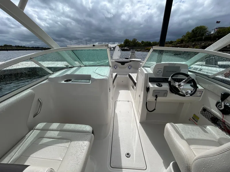 Slide: The Image of 2024 Sailfish 226 DC boat interior with modern dashboard and seating. - 8