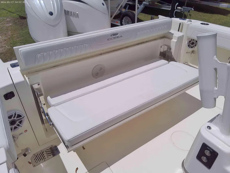 Slide: The Image of 2025 Cobia 265 Center Console boat with foldable seating and Yamaha engine. - 13