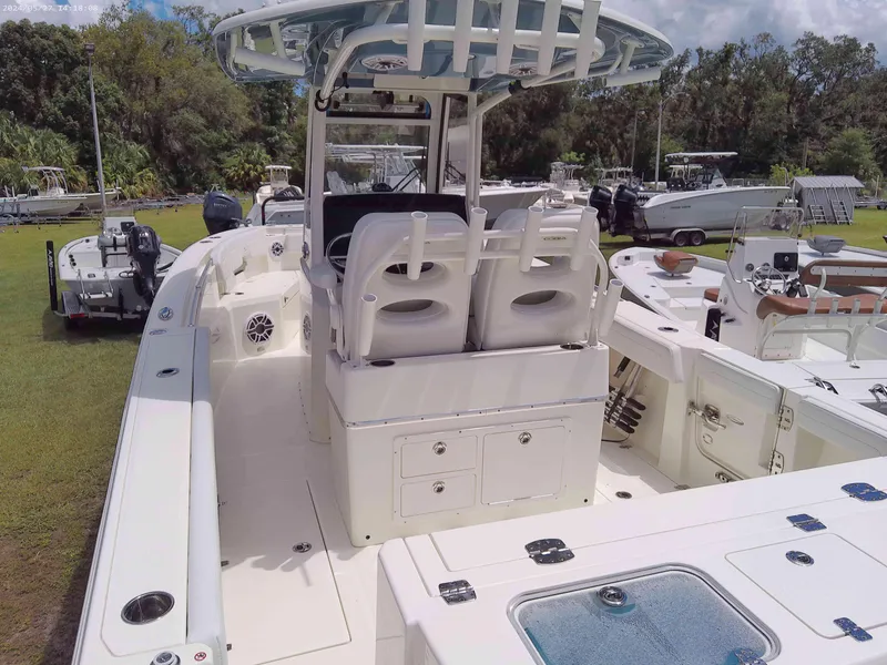 Slide: The Image of 2025 Cobia 265 Center Console boat with spacious deck and seating. - 2