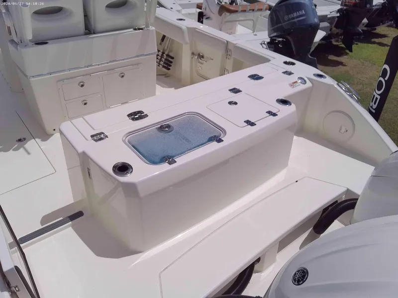 Slide: The Image of 2025 Cobia 265 Center Console boat interior with seating and storage compartments. - 3