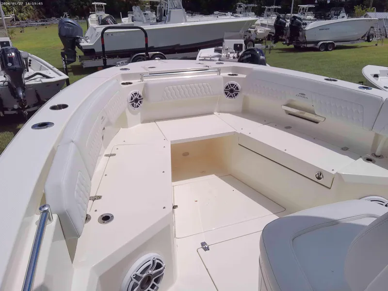 Slide: The Image of 2025 Cobia 265 Center Console boat interior with spacious seating and modern design. - 7