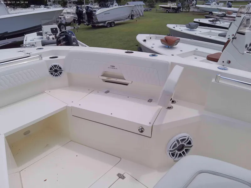 Slide: The Image of 2025 Cobia 265 Center Console boat interior with seating and speakers. - 8