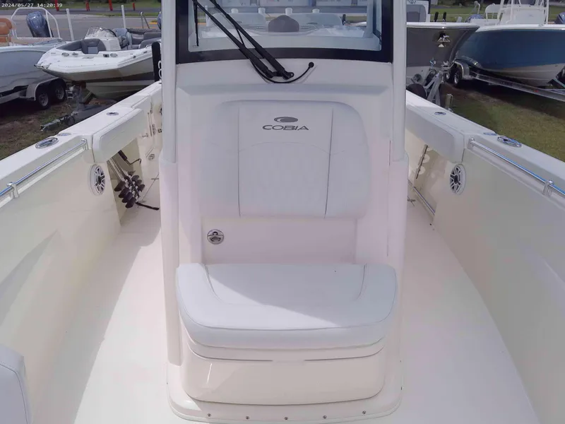 Slide: The Image of 2025 Cobia 265 Center Console boat interior with seating and console view. - 9