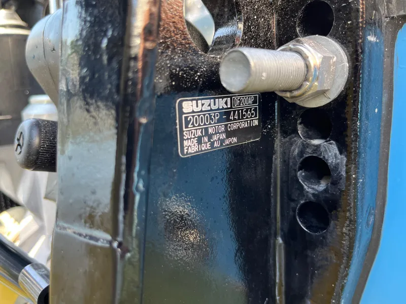 Slide: The Image of Close-up of Suzuki outboard motor label on 2024 Sailfish 226 DC boat. - 28