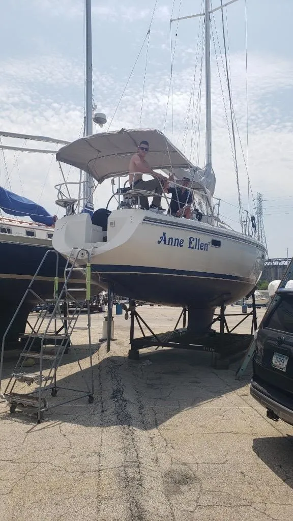 Slide: The Image of 1994 Catalina 36 sailboat named "Anne Ellen" on dry dock with ladder access. - 1