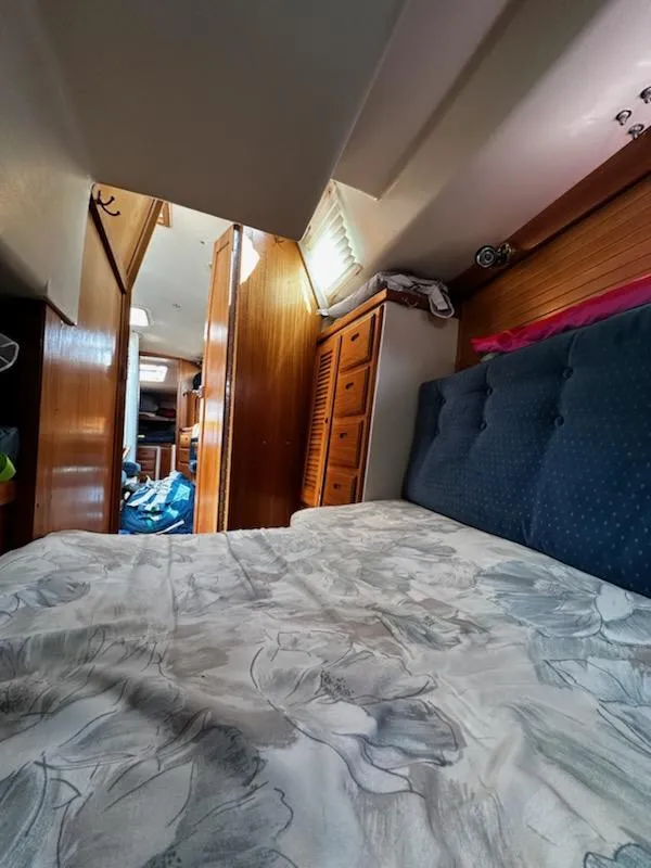 Slide: The Image of Interior of 1994 Catalina 36 sailboat with cozy cabin and bed. - 32