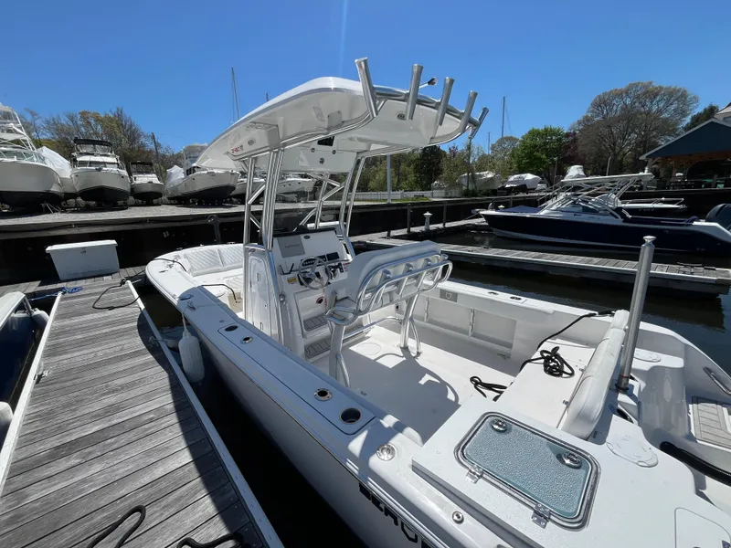 Slide: The Image of 2025 Sea Fox 248 Commander boat docked, featuring sleek design and modern amenities. - 2