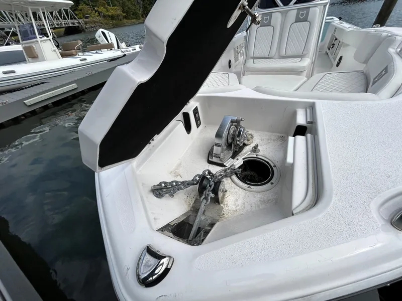 Slide: The Image of 2025 Sea Fox 248 Commander anchor compartment with chain and winch. - 7