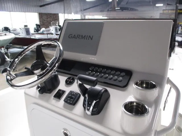 Slide: The Image of 2025 Skeeter SX230 boat console with Garmin display and controls. - 5