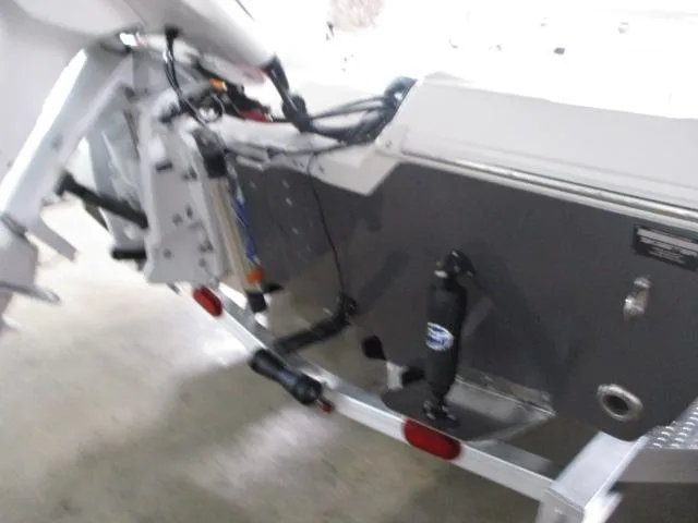 Slide: The Image of 2025 Skeeter SX230 boat transom with motor mount and wiring details. - 6