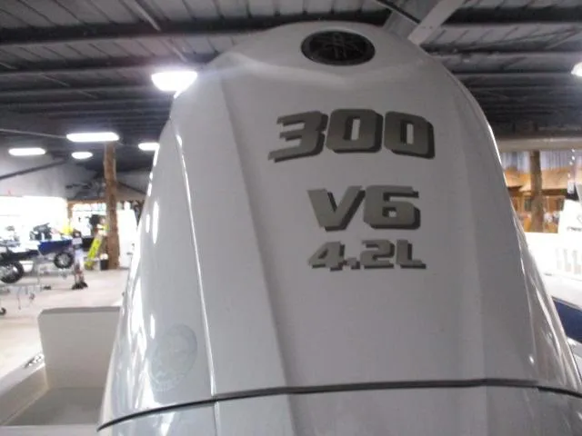 Slide: The Image of 2025 Skeeter SX230 boat engine, 300 V6 4.2L, in a showroom. - 8