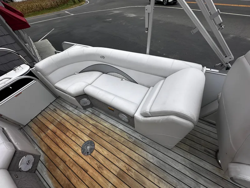 Slide: The Image of 2014 Avalon Catalina Quad Lounge with white seating and wooden deck. - 17