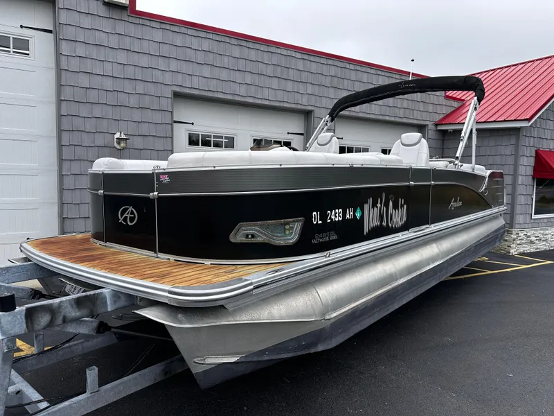 Slide: The Image of 2014 Avalon Catalina Quad Lounge 24' Triple Toon pontoon boat on trailer. - 2