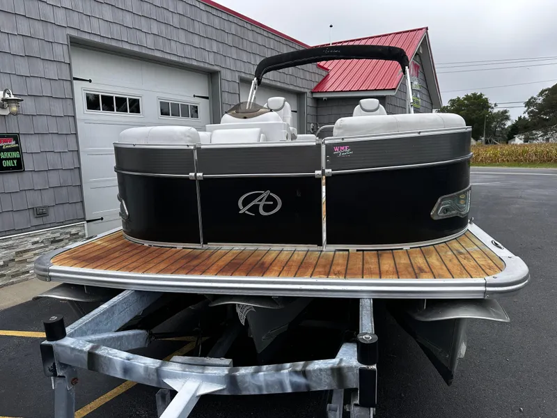 Slide: The Image of 2014 Avalon Catalina Quad Lounge 24' Triple Toon pontoon boat on trailer. - 3