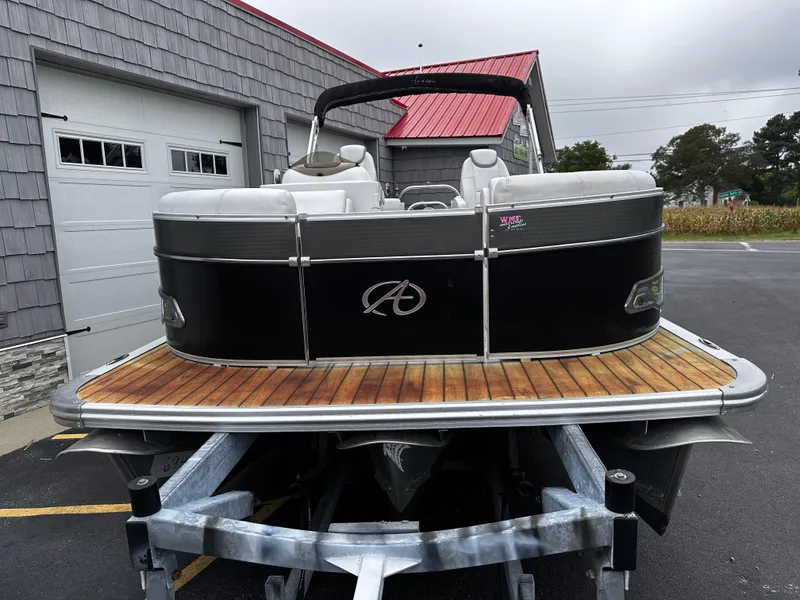 Slide: The Image of 2014 Avalon Catalina Quad Lounge 24' Triple Toon pontoon boat on trailer. - 4