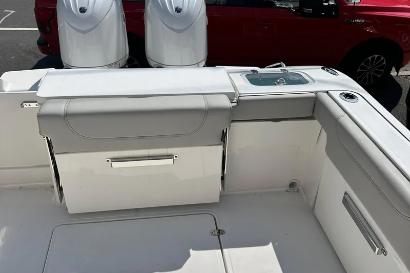 Slide: The Image of 2025 Pursuit DC 266 Dual Console boat interior with dual engines. - 10