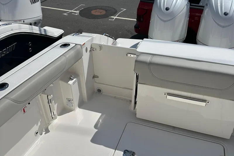 Slide: The Image of 2025 Pursuit DC 266 Dual Console boat interior with Yamaha engines. - 11