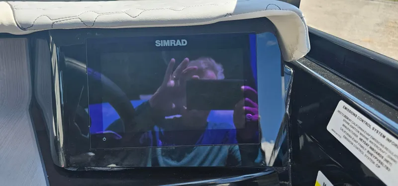 Slide: The Image of Simrad display on 2024 Heyday H22 boat dashboard with reflection. - 10
