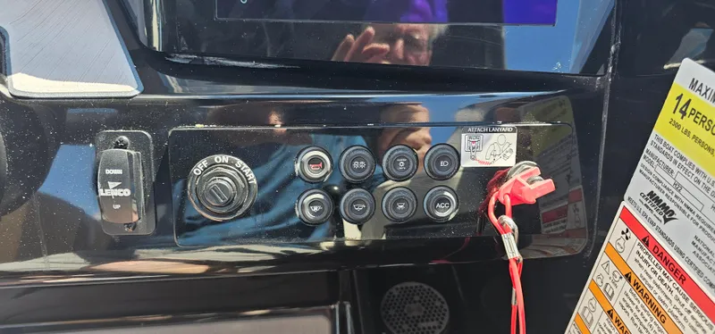 Slide: The Image of Control panel of 2024 Heyday H22 boat with switches and safety instructions. - 11